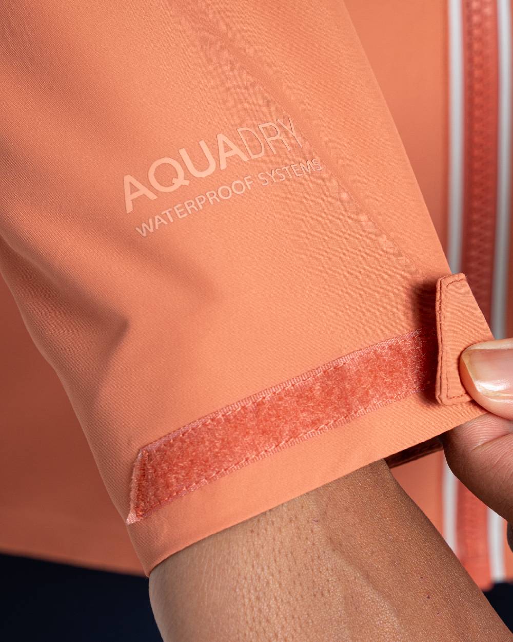 Red Sandstone coloured Craghoppers Womens Solla Waterproof Jacket on white background 