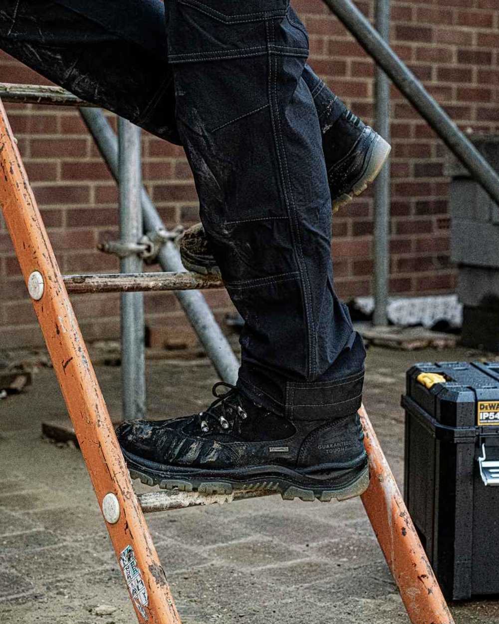 Black Coloured DeWalt Challenger Waterproof Safety Hiker Boots on outdoor background 