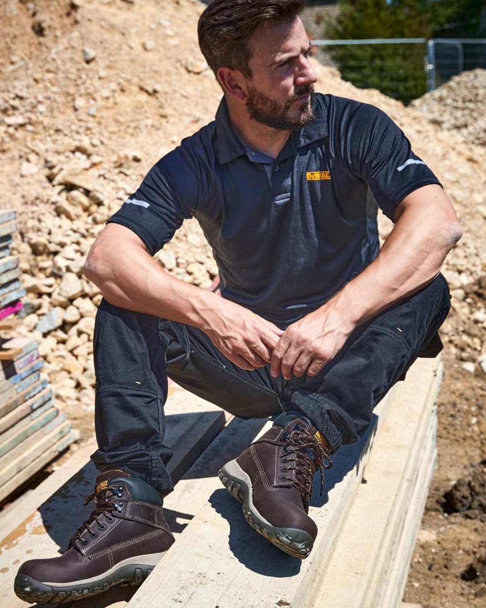 Brown Coloured DeWalt Hammer Non-Metallic Safety Boot on outdoor  background 