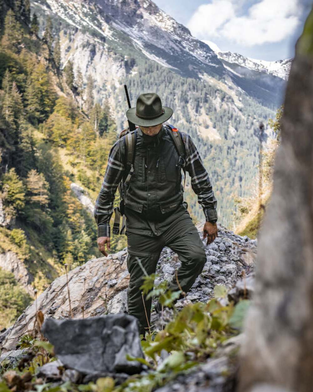 Green Coloured Deerhunter Adventurer Felt Hat on mountain background 