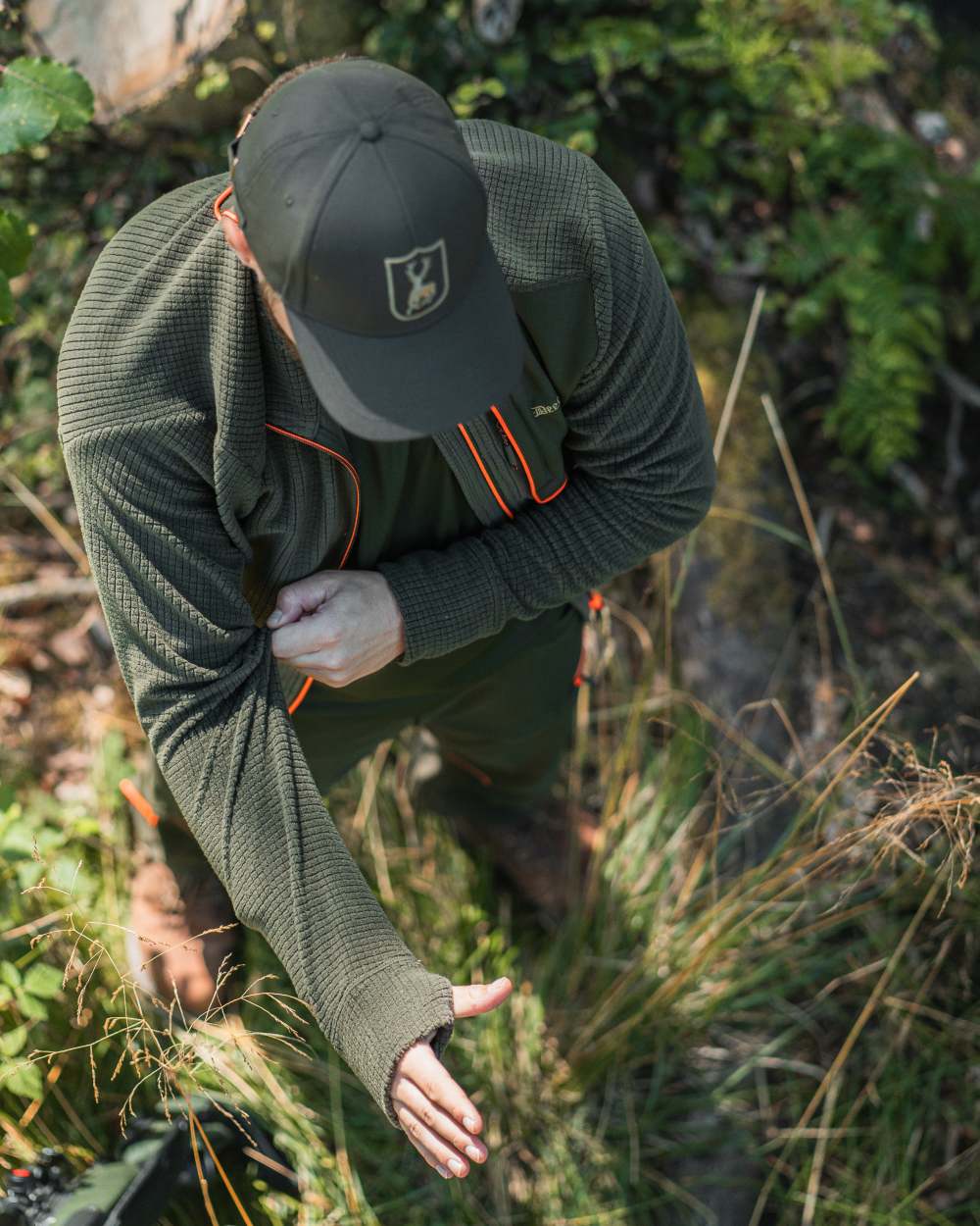 Forest Green coloured Deerhunter Chamois Full Zip Fleece Jacket on forest background 