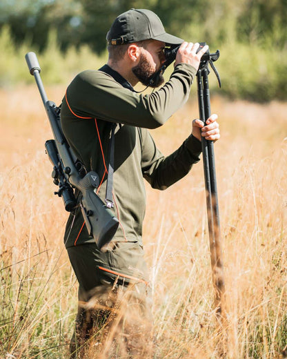 Forest Green Coloued Deerhunter Chamois Long Sleeve T-Shirt on forest background 
