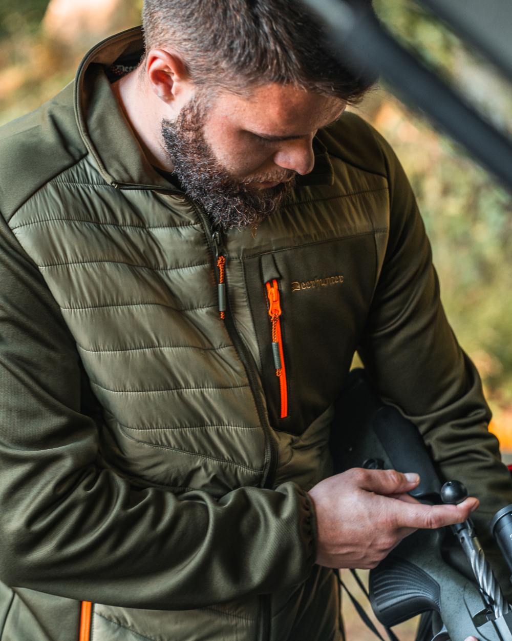 Forest Green coloured Deerhunter Chamois Padded Jacket on forest background 