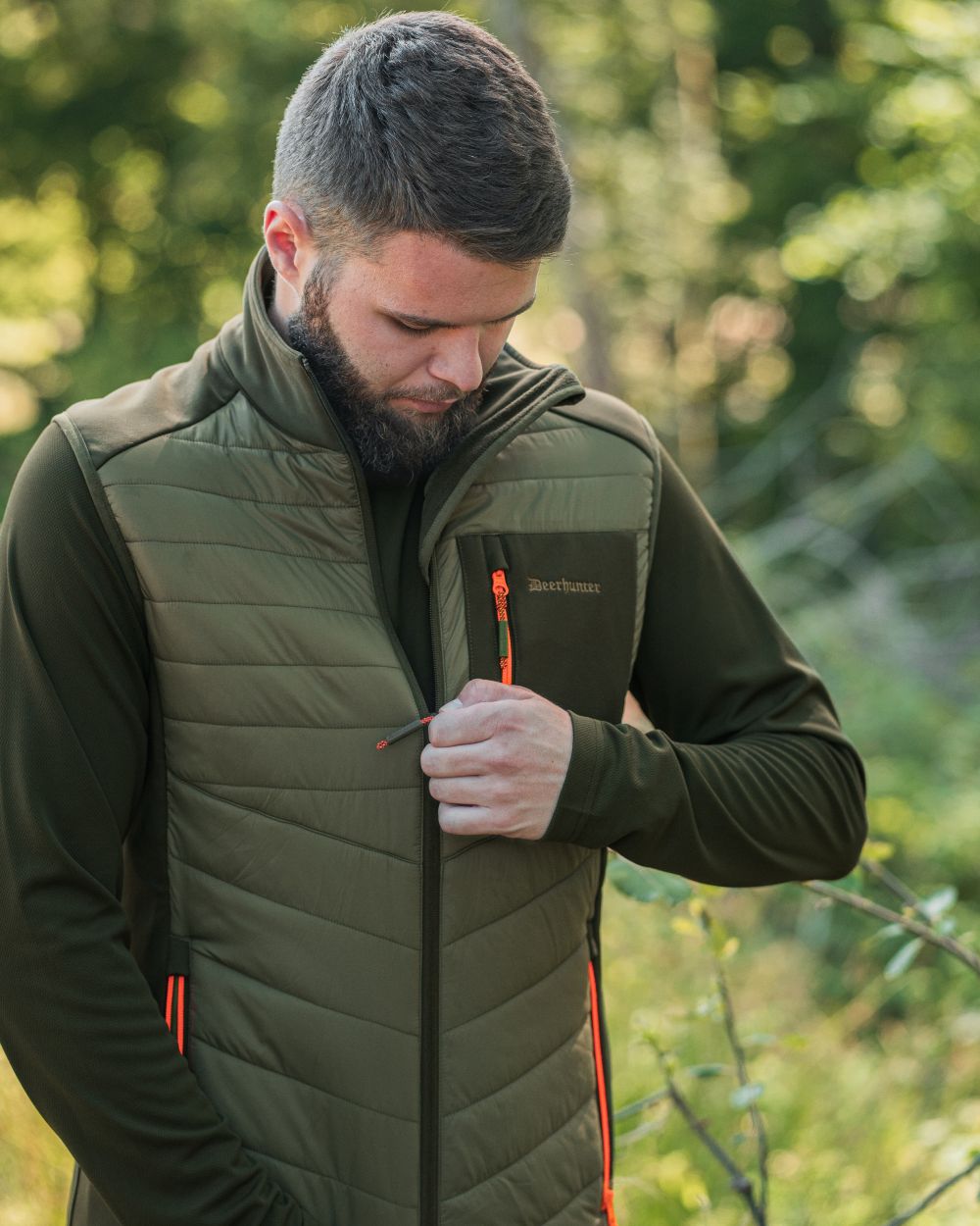 Forest Green coloured Deerhunter Chamois Padded Waistcoat on forest background 