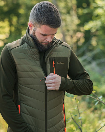 Forest Green coloured Deerhunter Chamois Padded Waistcoat on forest background 