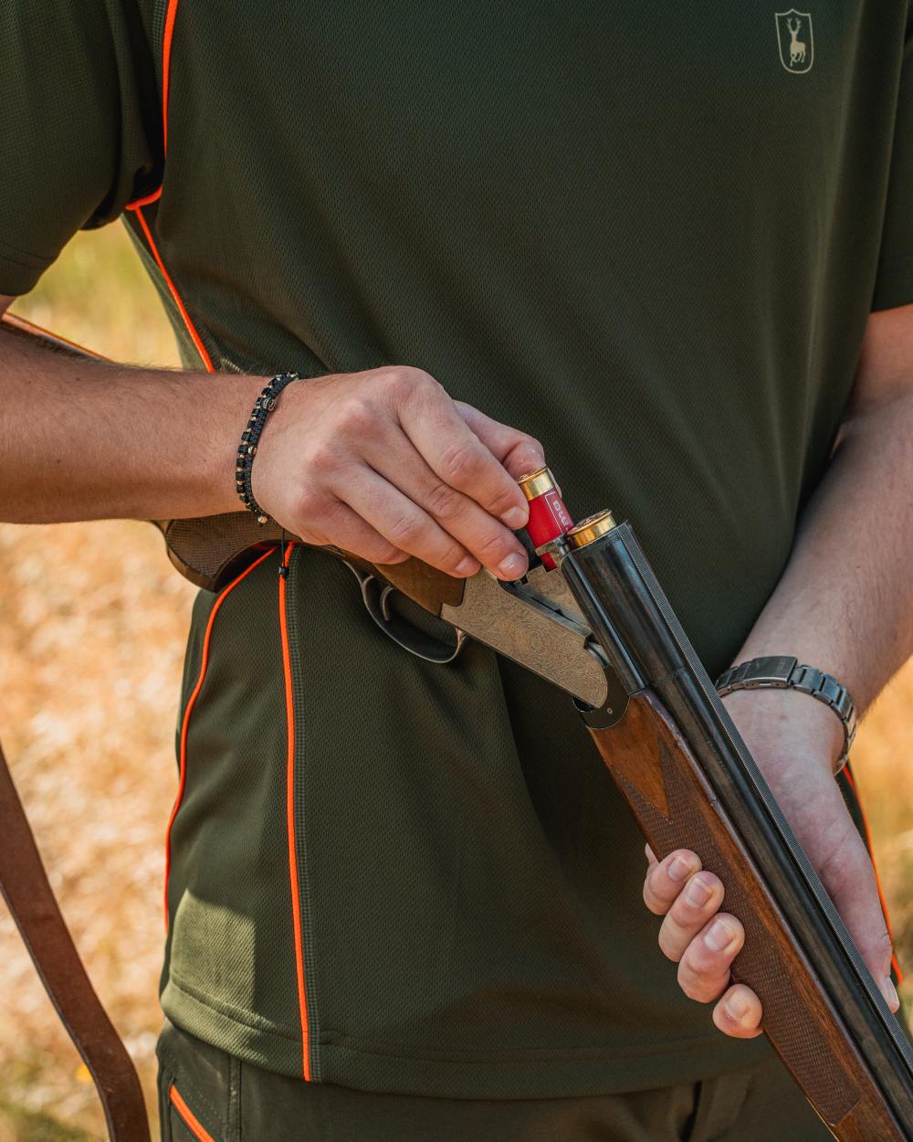 Forest Green coloured Deerhunter Chamois Short Sleeve T-Shirt on forest background 
