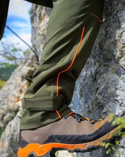 Forest Green coloured Deerhunter Chamois Trousers on mountain background 
