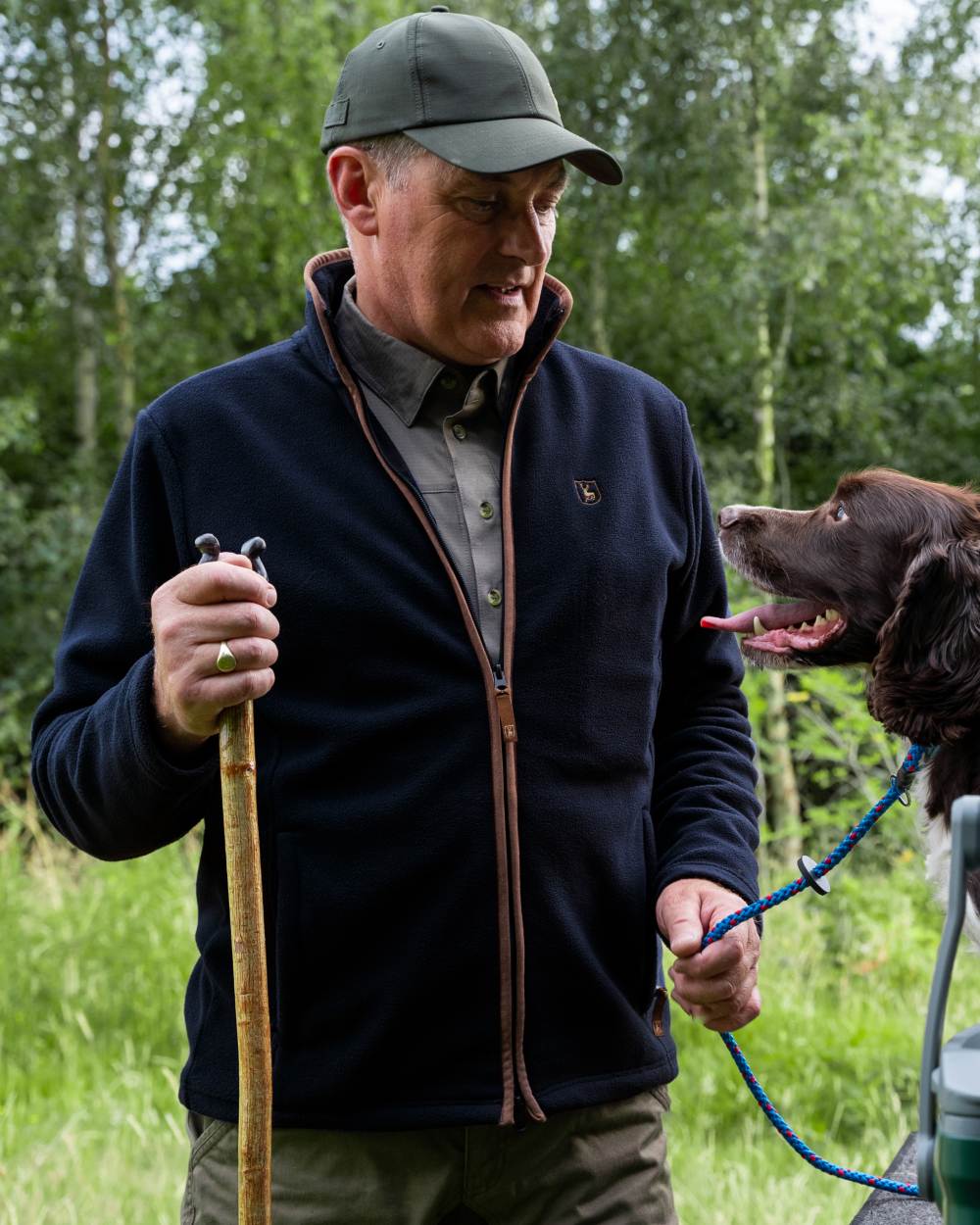 Dark Blue coloured Deerhunter Cumbria Fleece Jacket on forest background 