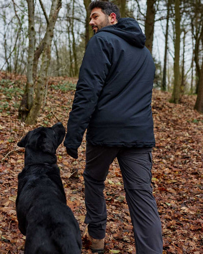 Dark Blue coloured Deerhunter Denver Winter Jacket on forest background 