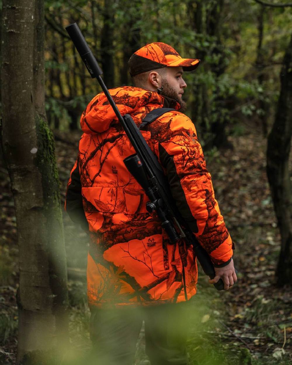 Realtree Edge Orange Coloured Deerhunter Eagle Winter Jacket On A Forest Background 