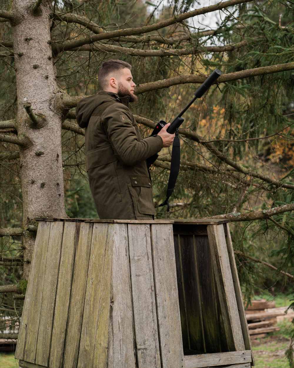 Tarmac Green Coloured Deerhunter Eagle Winter Jacket On A Forest Background 