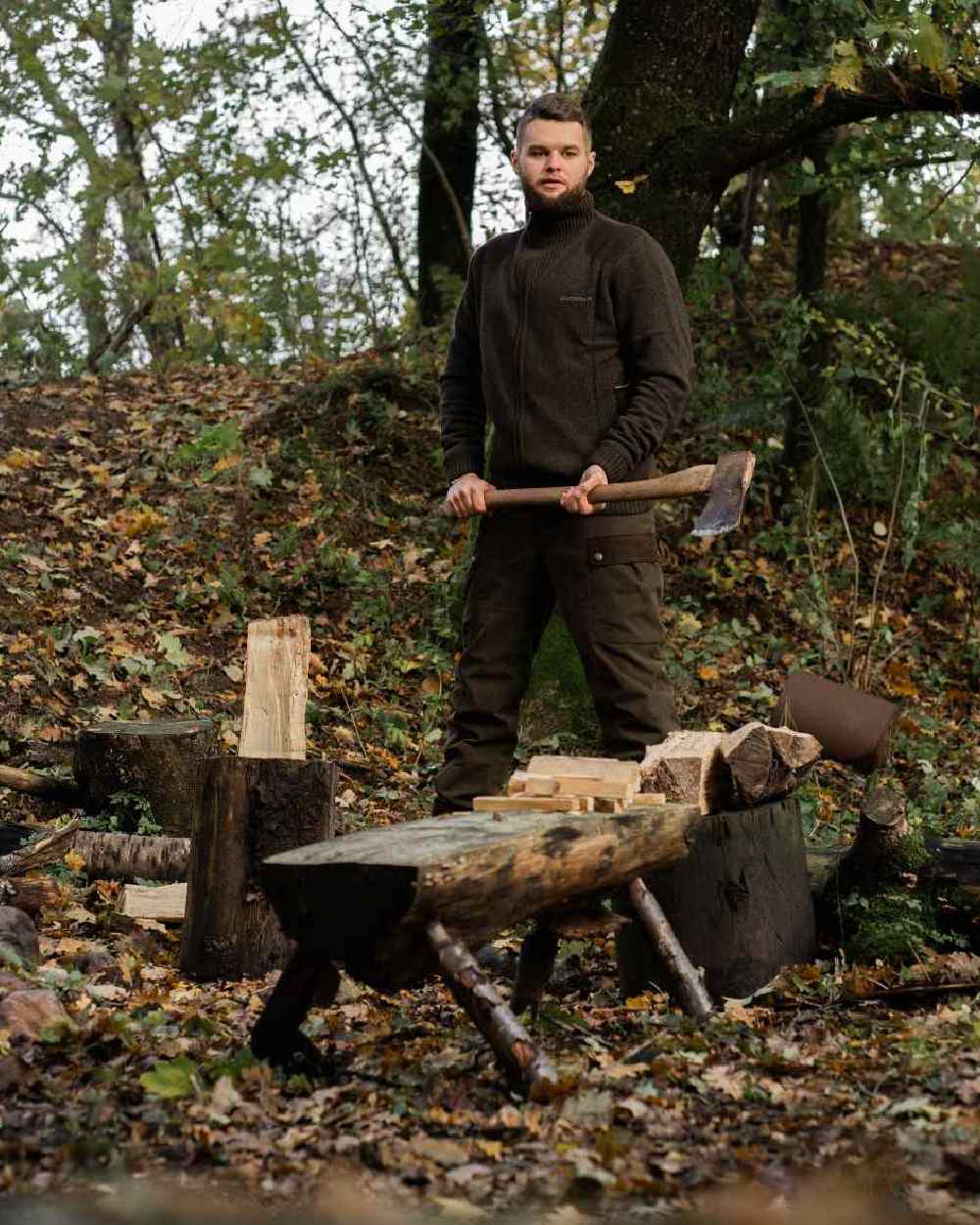Tarmac Green Coloured Deerhunter Eagle Winter Trousers On A Forest Background 