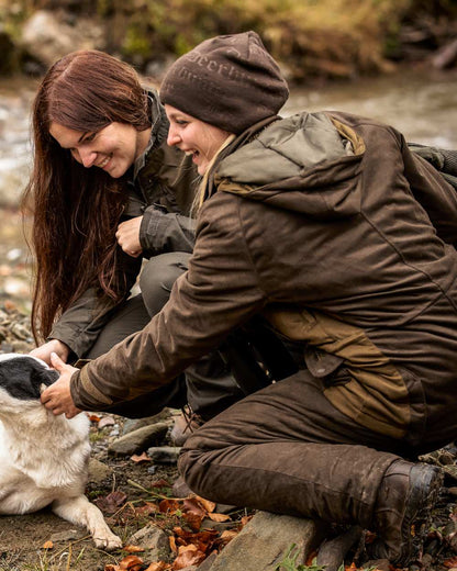 Walnut coloured Deerhunter Embossed Logo Beanie on forest background 