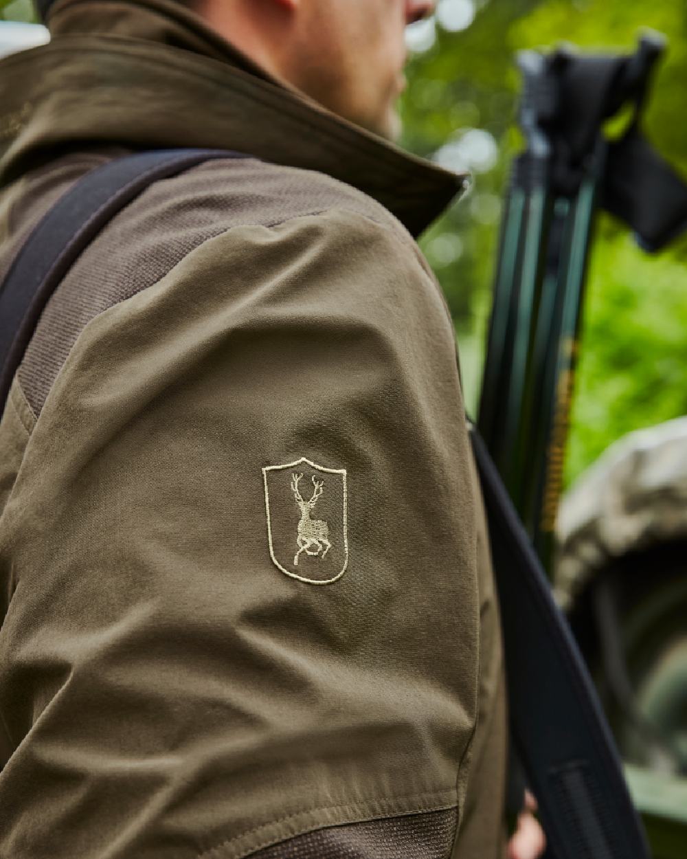 Art Green coloured Deerhunter Excape Light Jacket on blurry background 