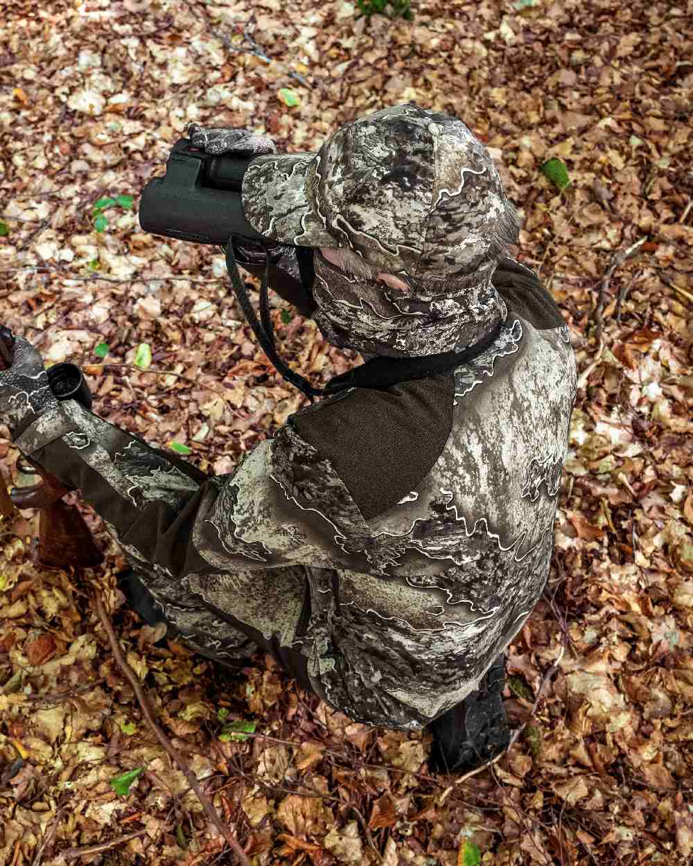 Realtree Excape coloured Deerhunter Excape Light Jacket on leaf background 