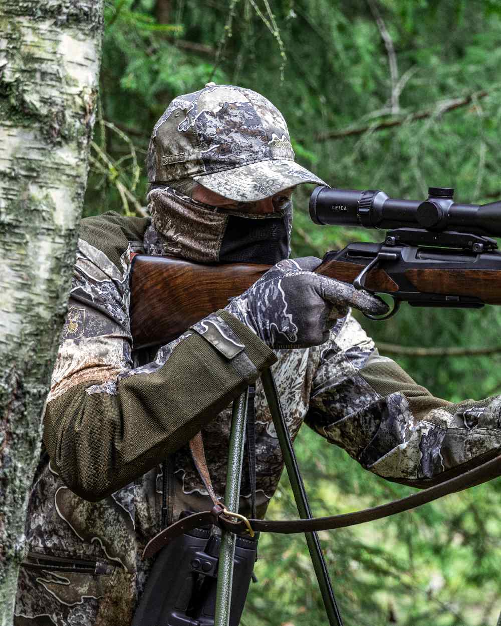 Realtree Excape coloured Deerhunter Excape Light Jacket on forest background 