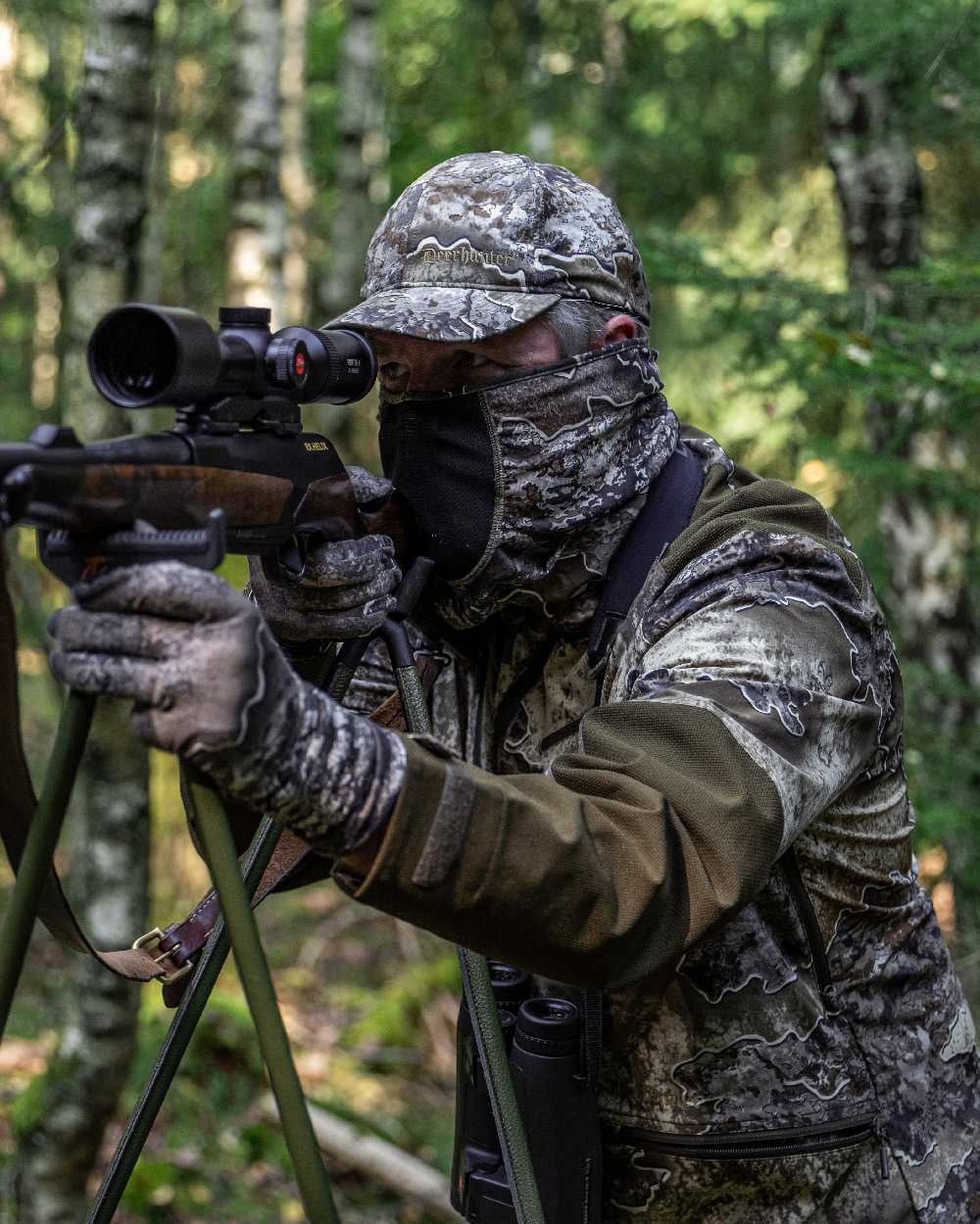 Realtree Excape coloured Deerhunter Excape Light Jacket on forest background 