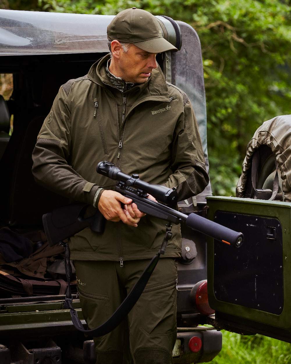 Art Green coloured Deerhunter Excape Light Trousers on jeep background 