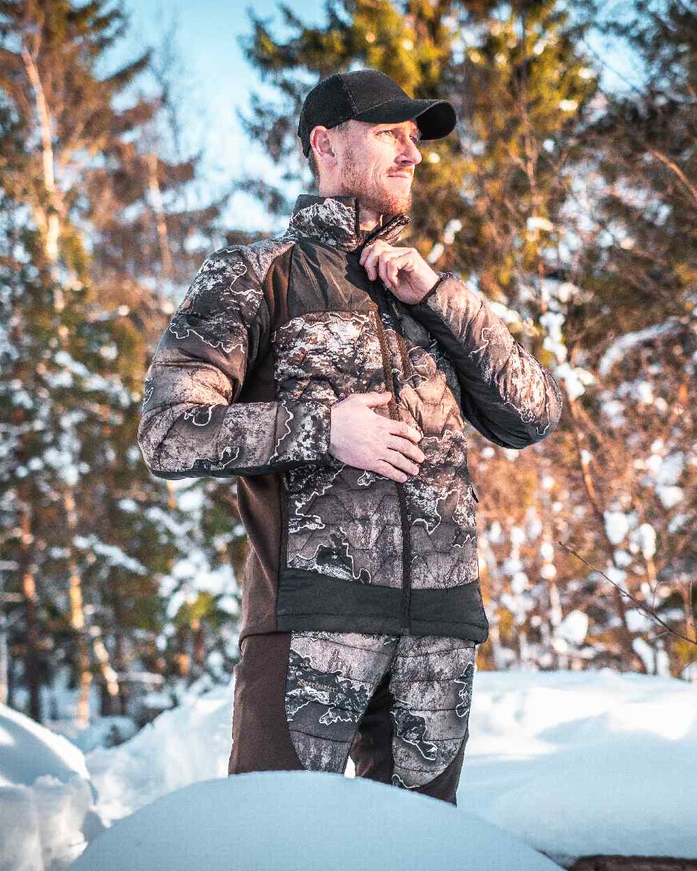 Realtree Excape coloured Deerhunter Excape Quilted Jacket on snow background 