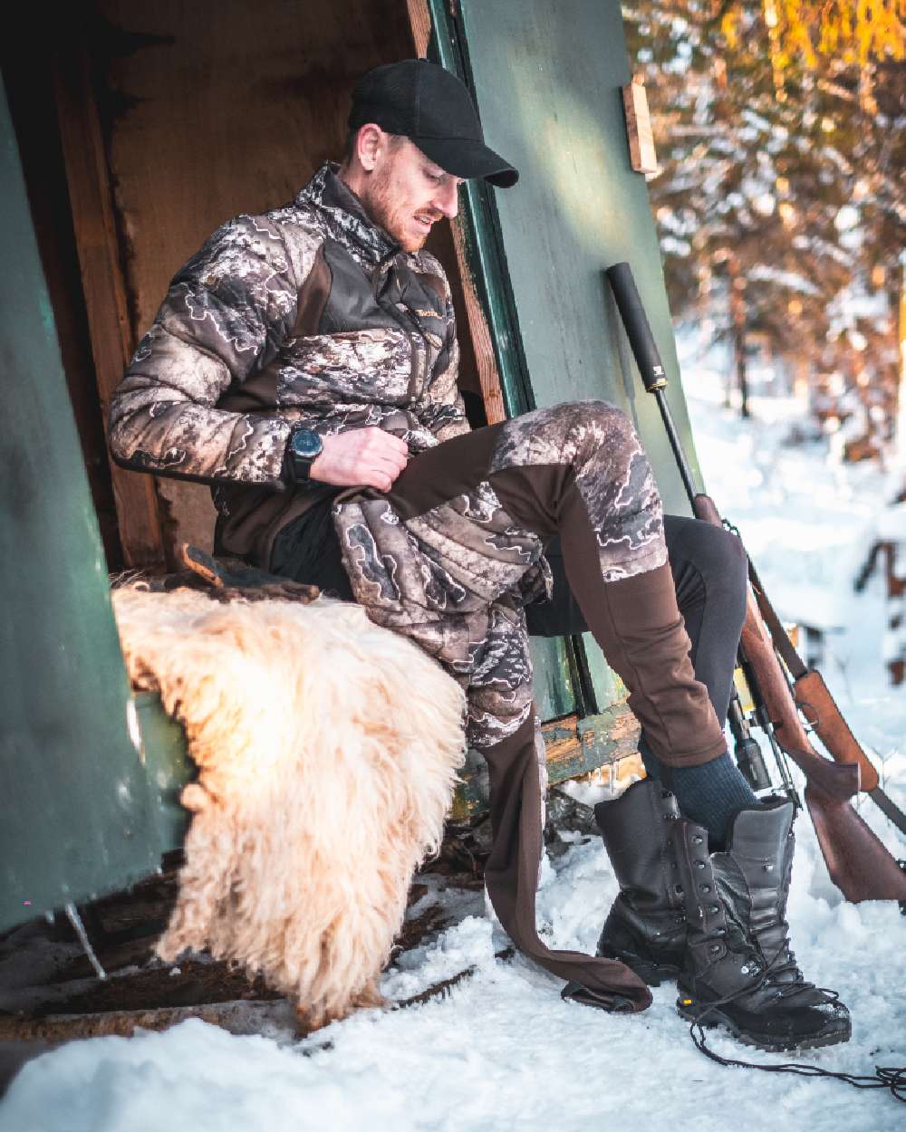 Realtree Excape coloured Deerhunter Excape Quilted Jacket on snow background 
