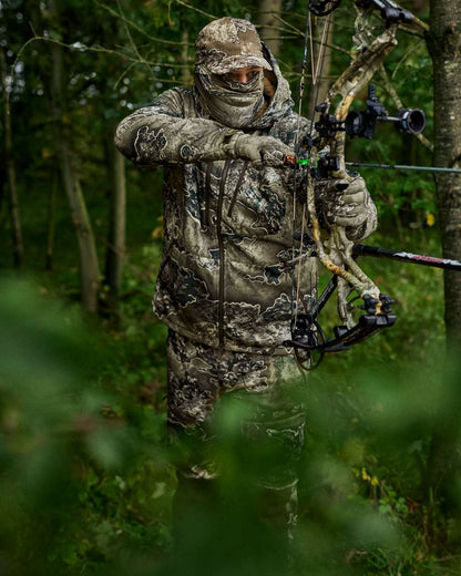 Realtree Excape coloured Deerhunter Excape Softshell Jacket on forest background 