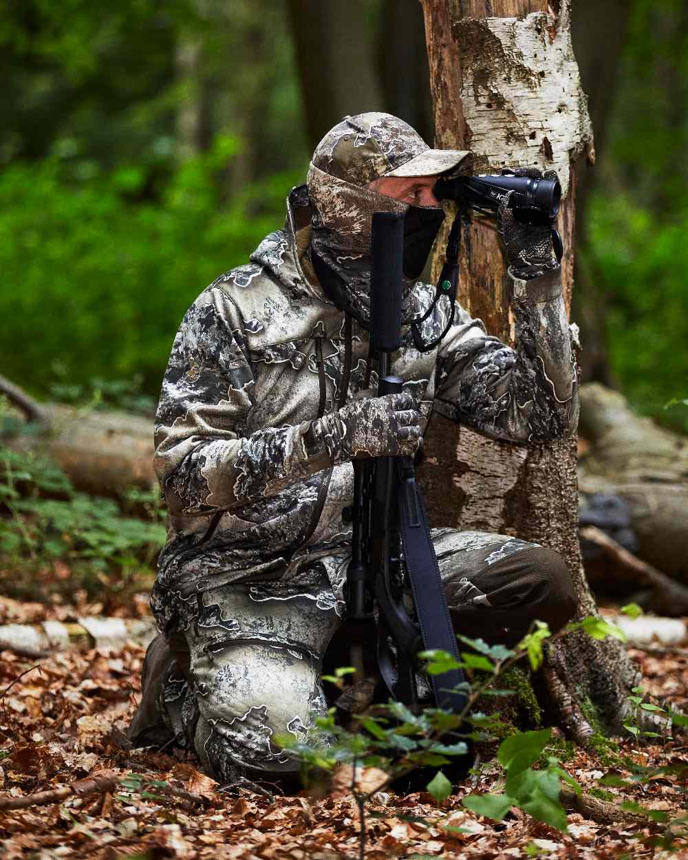 Realtree Excape coloured Deerhunter Excape Softshell Jacket on forest background 