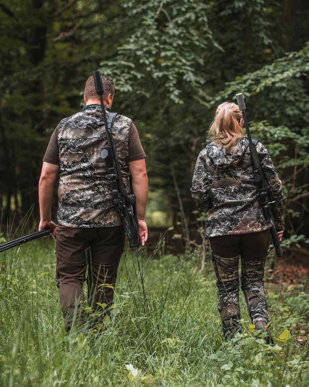 Realtree Excape coloured Deerhunter Excape Softshell Waistcoat on forest background 