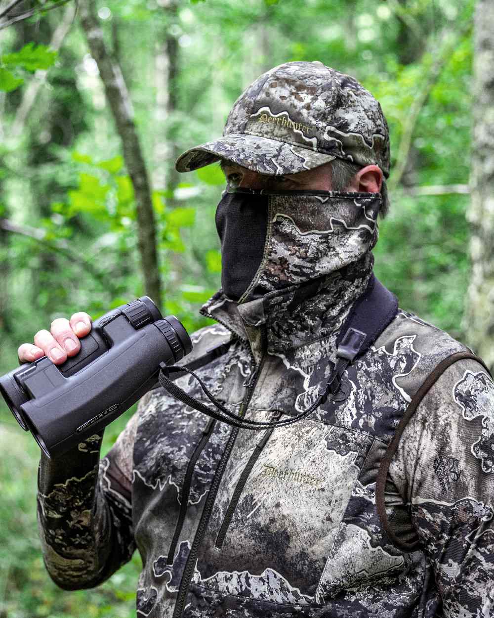 Realtree Excape coloured Deerhunter Excape Softshell Waistcoat on forest background 