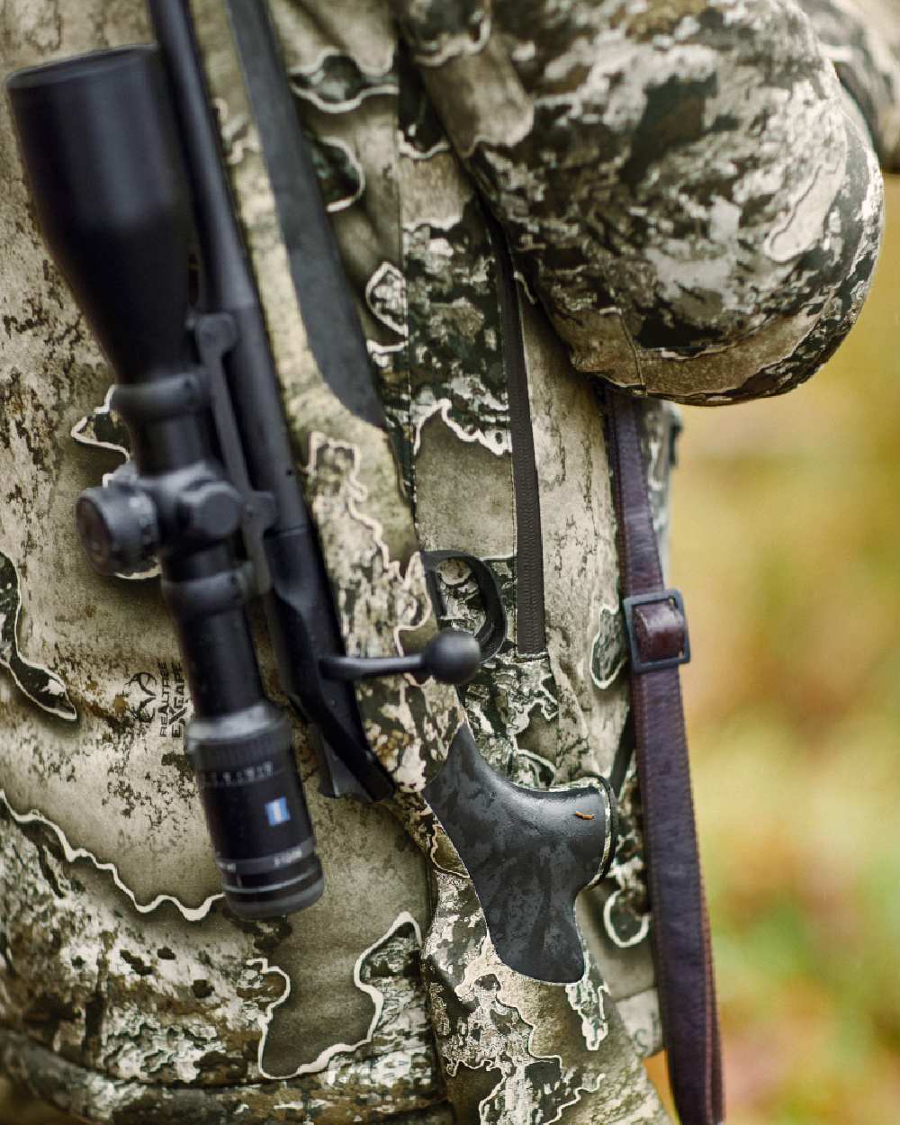 Realtree Excape coloured Deerhunter Excape Winter Waterproof Jacket on blurry background 