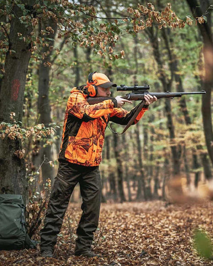 Realtree Edge Orange Coloured Deerhunter Explore Jacket on forest background 