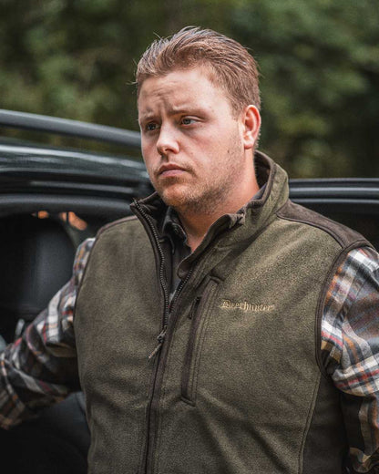 Graphite Green coloured Deerhunter Gamekeeper Bonded Fleece Waistcoat on blurry background 