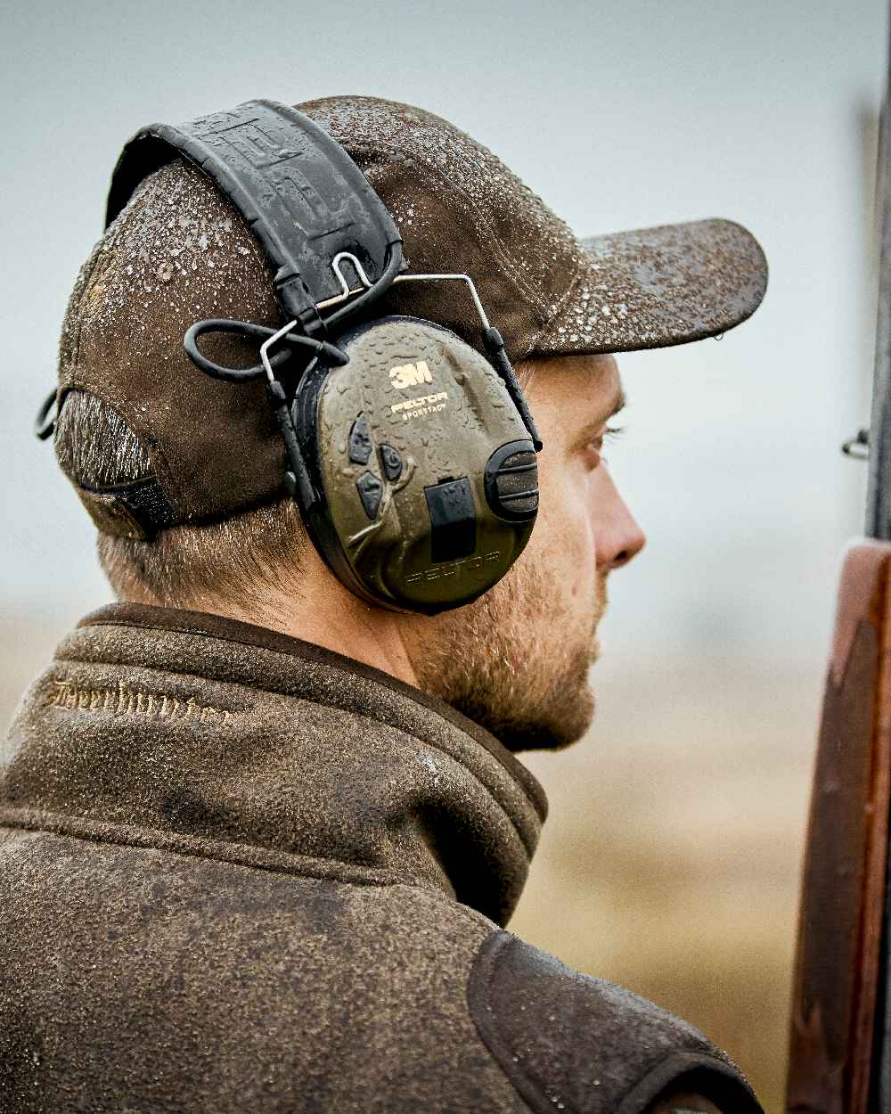 Graphite Green Coloured Deerhunter Gamekeeper Shooting Waistcoat on blurry background 