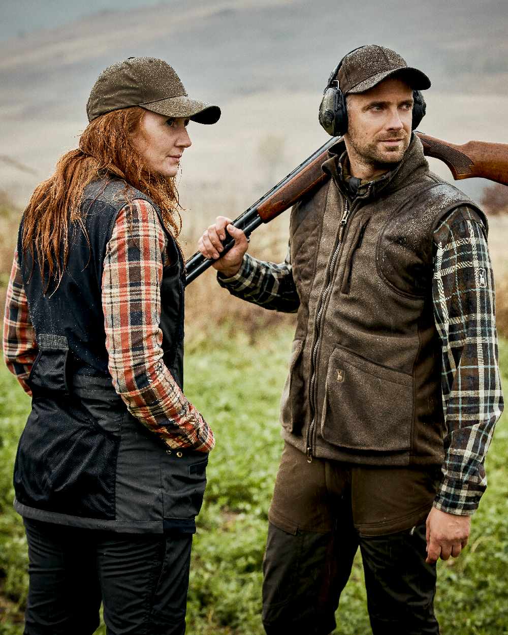 Graphite Green Coloured Deerhunter Gamekeeper Shooting Waistcoat on forest background 