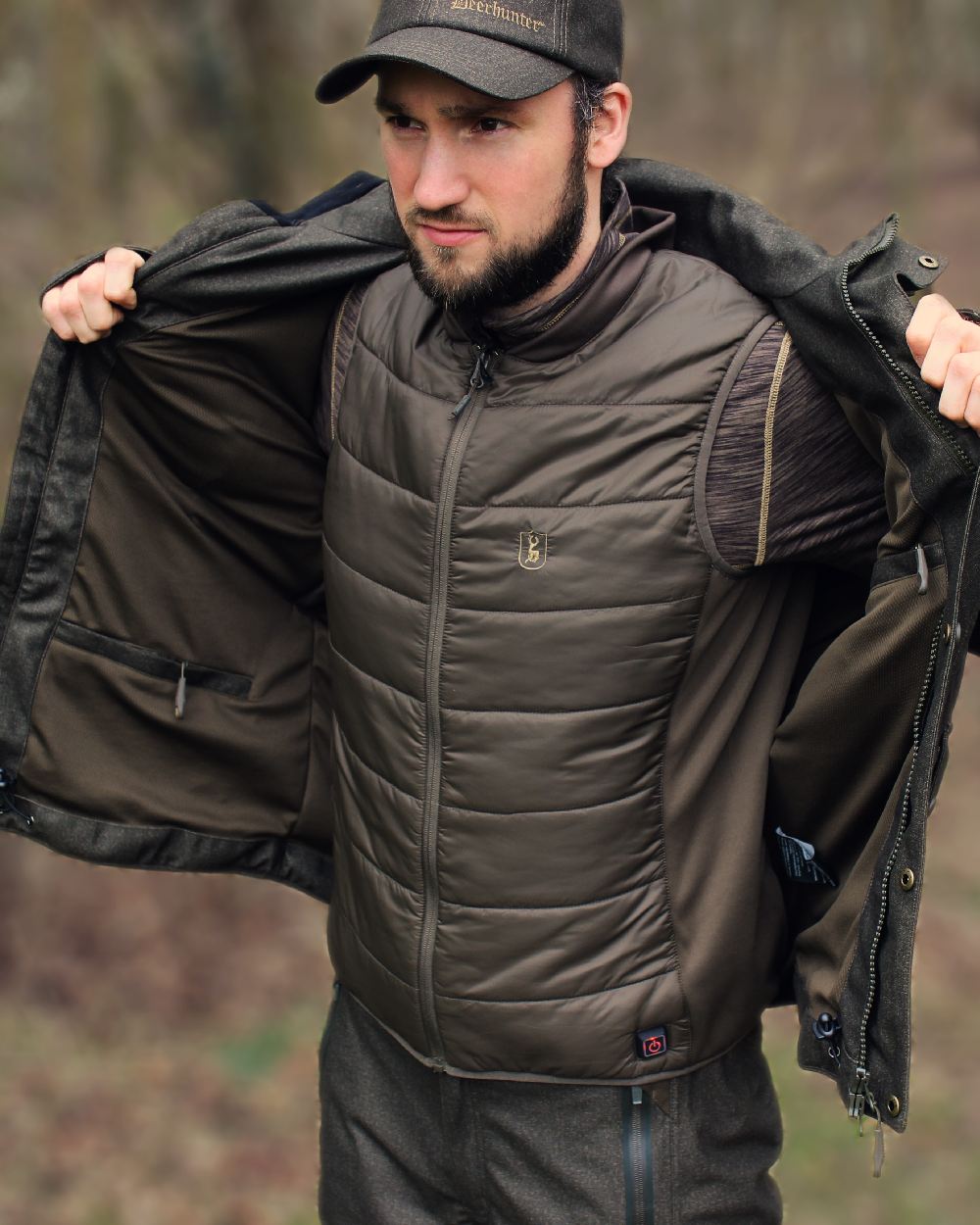 Deep Green Coloured Deerhunter Heat Inner Waistcoat on blurry background 