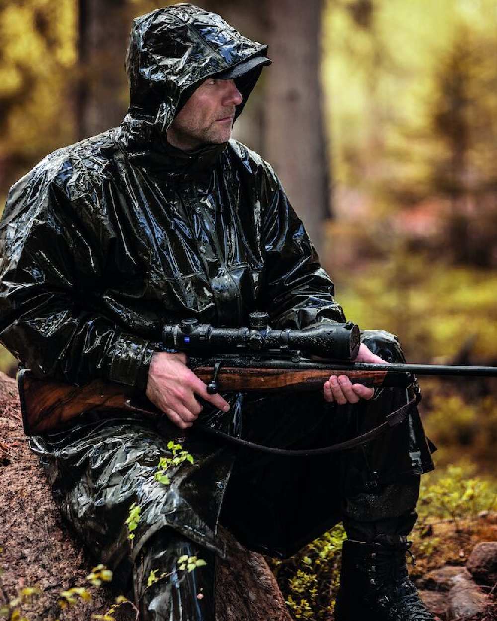 Art Green Coloured Deerhunter Hurricane Long Rain Coat on blurry background 