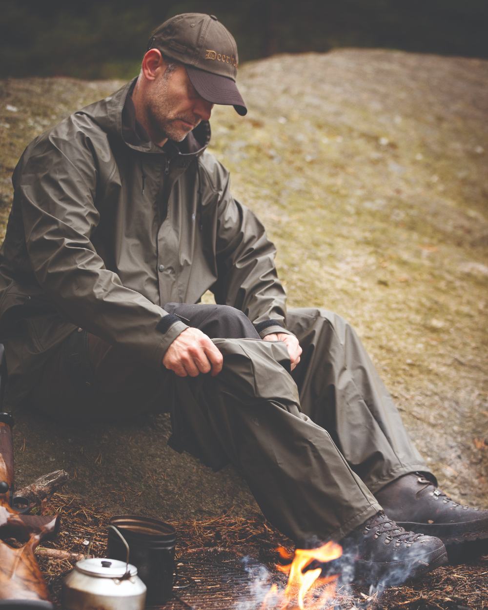 Art Green coloured Deerhunter Hurricane Rain Trousers on forest background 