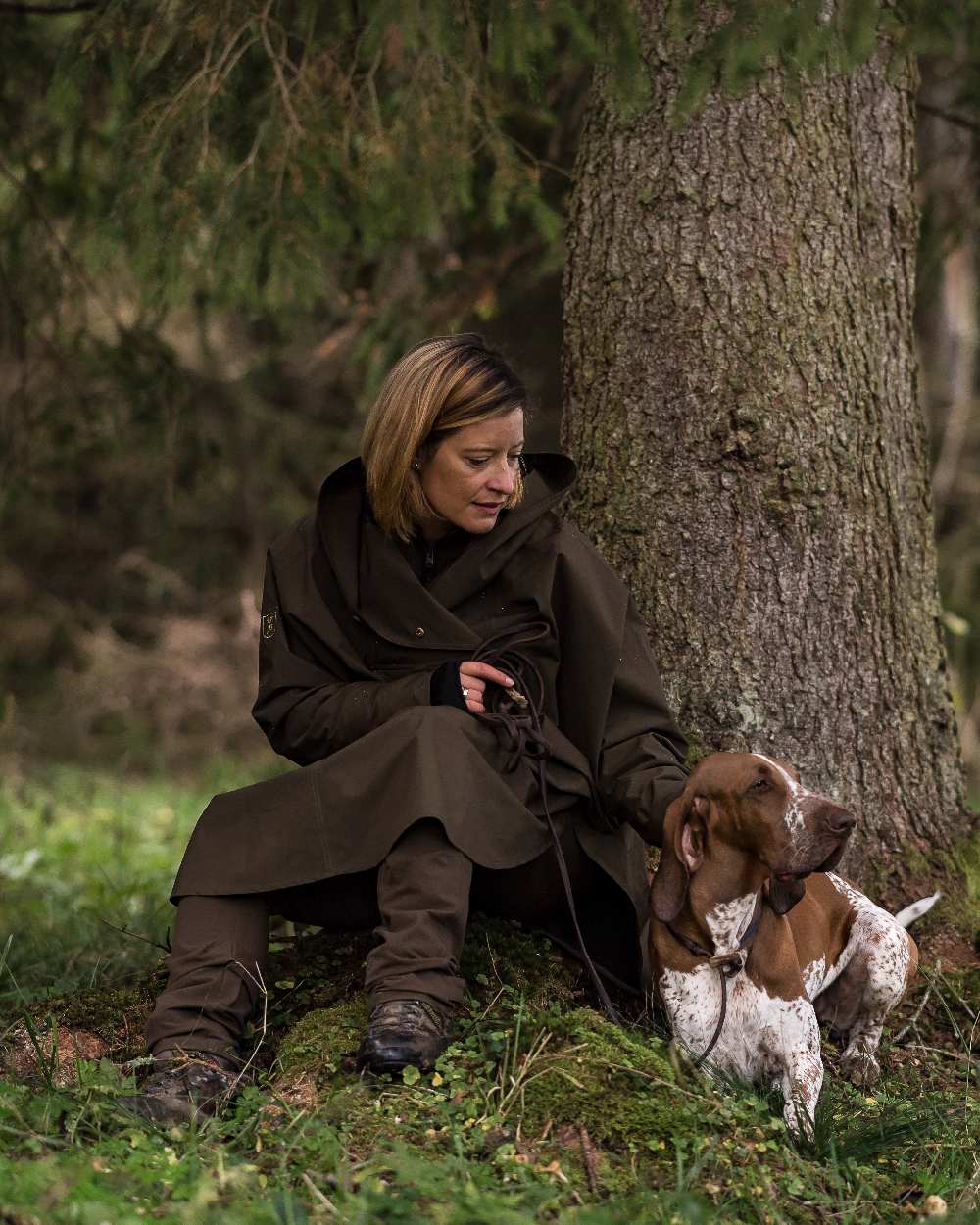 Canteen Coloured Deerhunter Ladies Waterproof Rain Poncho on forest background 