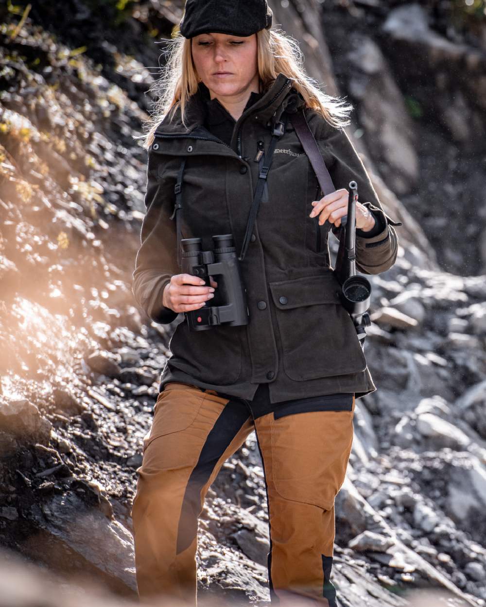Bronze coloured Deerhunter Lady Ann Trousers on mountain background 
