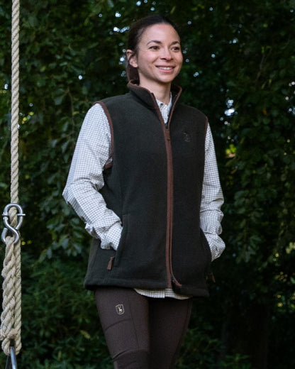 Forest Ember Coloured Deerhunter Lady Cumbria Fleece Waistcoat on forest background 