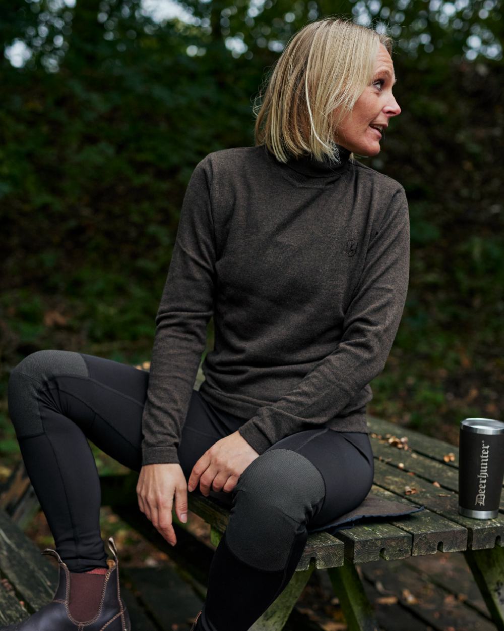 Dark Elm coloured Deerhunter Lady Darlington Roll Neck on forest background 