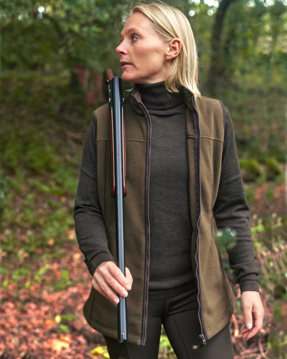 Tarmac Green Coloured Deerhunter Lady Eagle Fleece Waistcoat on forest background 