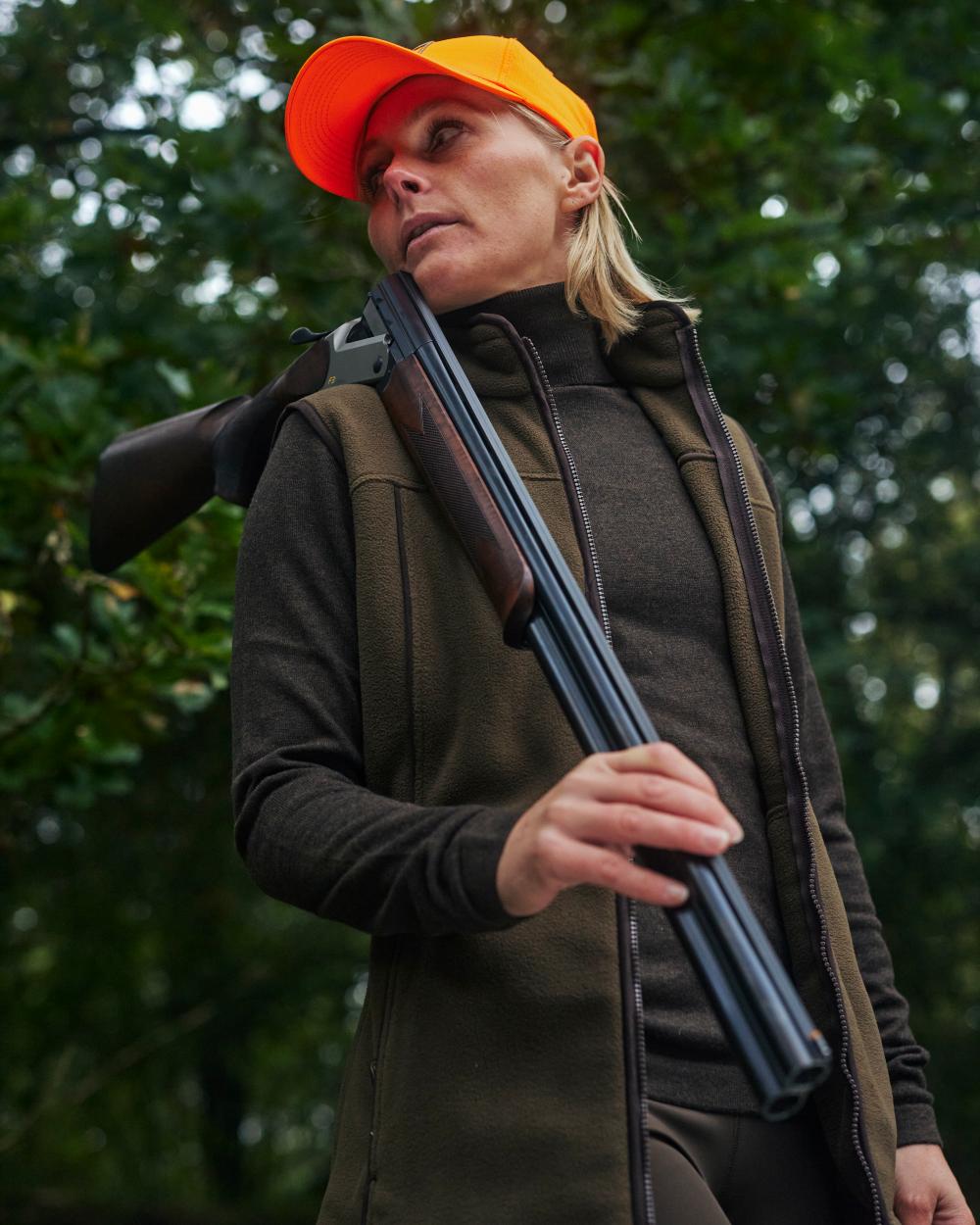 Tarmac Green Coloured Deerhunter Lady Eagle Fleece Waistcoat on forest background 