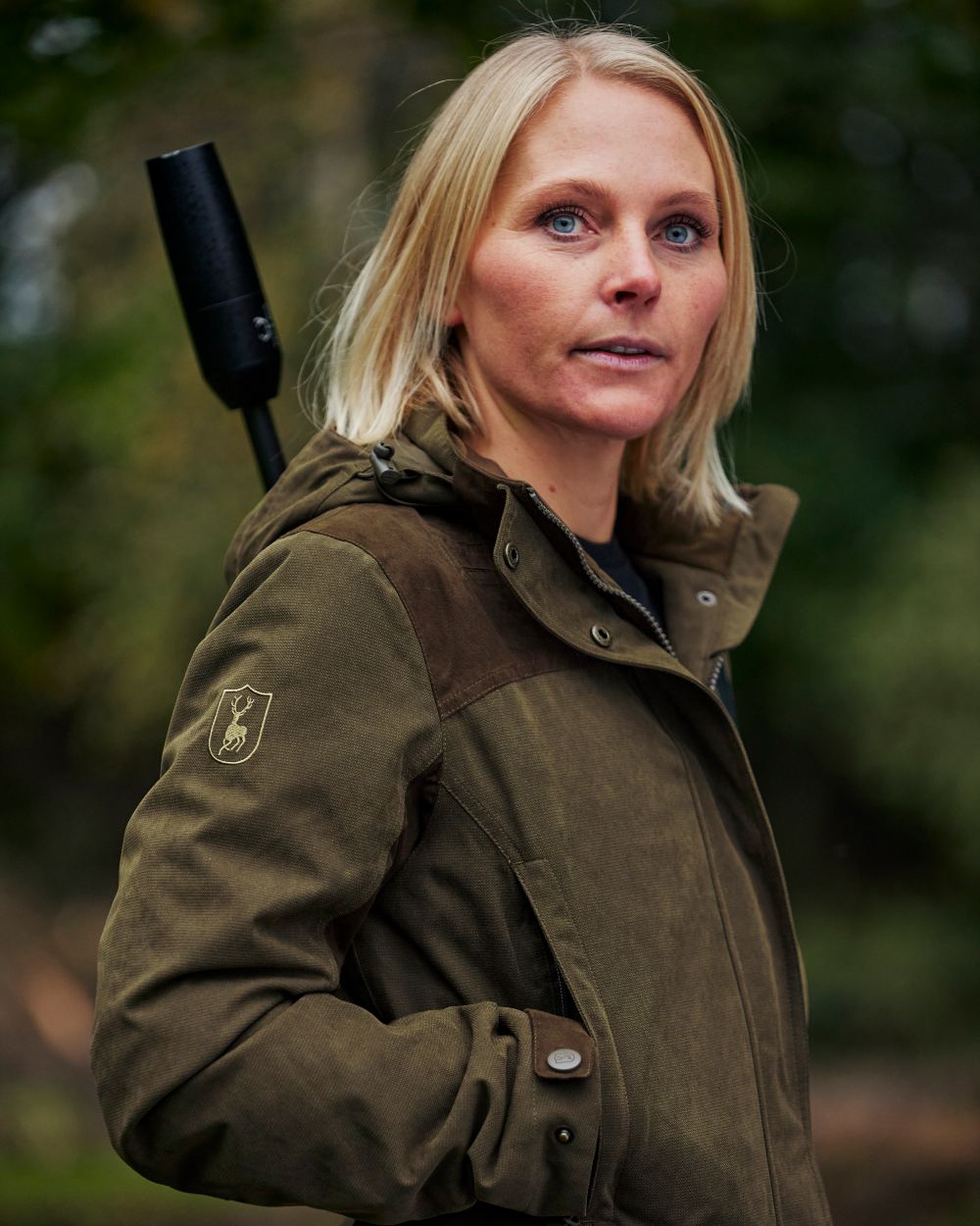 Tarmac Green Coloured Deerhunter Lady Eagle Jacket on blurry background 