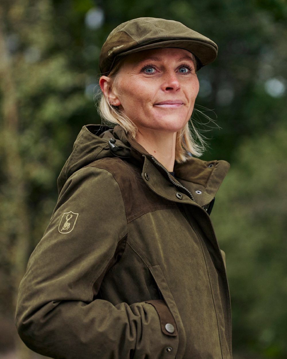 Tarmac Green Coloured Deerhunter Lady Eagle Jacket on blurry background 