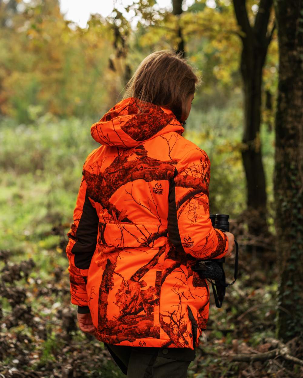 Realtree Edge Orange coloured Deerhunter Lady Eagle Winter Jacket  on forest background 