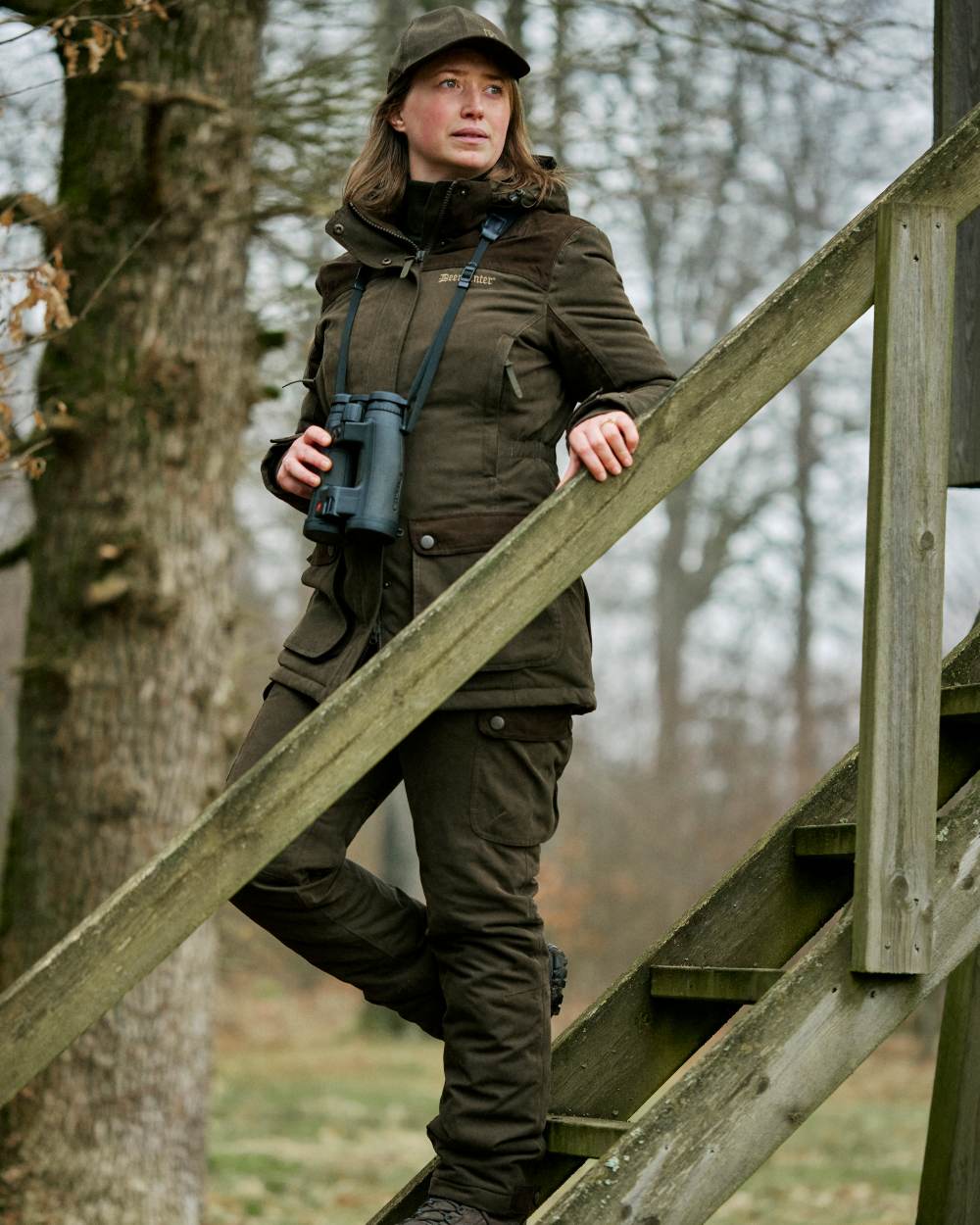 Tarmac Green coloured Deerhunter Lady Eagle Winter Jacket on forest background 