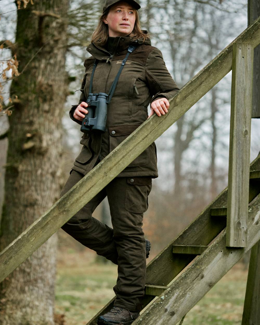 Tarmac Green coloured Deerhunter Lady Eagle Winter Trousers on forest background 