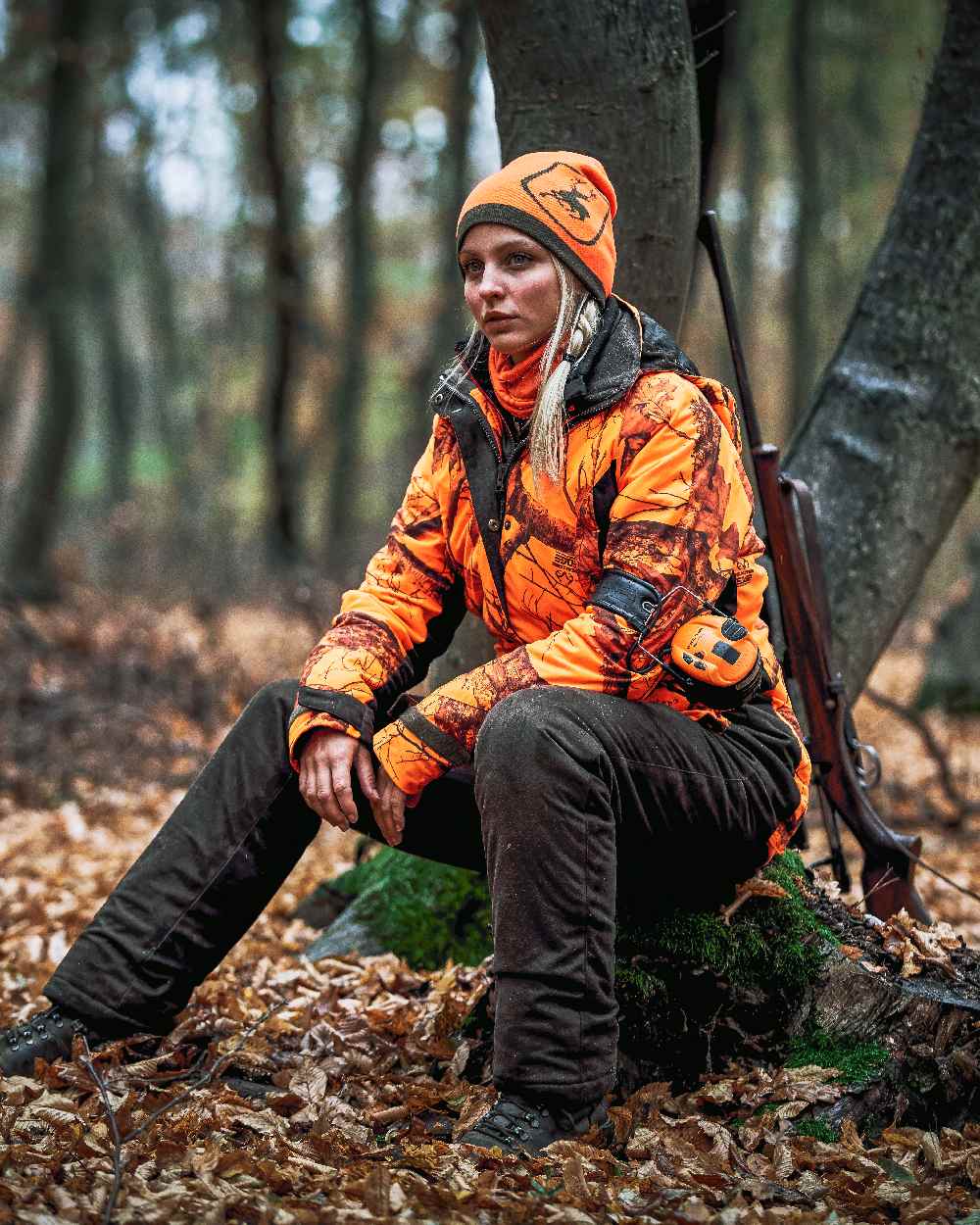 Realtree Edge Orange Coloured Deerhunter Lady Estelle Winter Jacket on forest background 