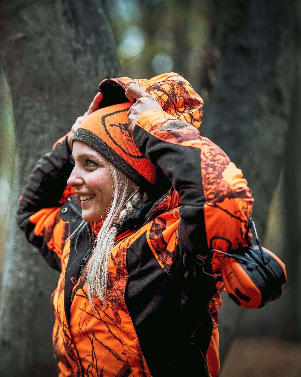 Realtree Edge Orange Coloured Deerhunter Lady Estelle Winter Jacket on forest background 