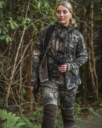 Realtree Excape coloured Deerhunter Lady Excape Softshell Trousers on forest background 